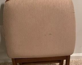 One wooden folding chair.