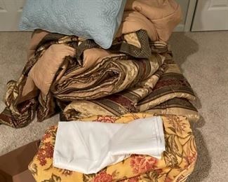Assorted bed linens.