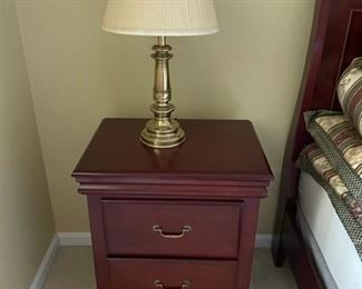 End table and brass lamp.