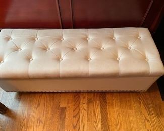 Tufted bench ottoman with storage.