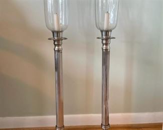 $100 - Pair of Tall Silver Metal Candle Stick Hurricanes JB103-4                                                                                                              Loaded with five-star style, these long stemmed silver metal candle holders offer a tulip shaped clear glass sleeve at top. This is a lovely pair of hurricanes that add elegance to any room or table.  
33"H

Both pieces are in Very Good Condition

Local pick up Bethesda MD.  Contact us for shipper suggestions.
