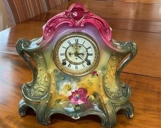 $760 - Antique Ansonia Royal Bonn La Layon Porcelain Mantle Clock Exceptional  JS45-10798                                            A vintage La Layon mantle clock by the Ansonia Clock Co., circa 1905. This American made timepiece features a round white face displaying black Roman numerals under glass, in a brass bezel, and the voluptuous porcelain case is hand painted with a European Pansy landscape and gold trim. The movement is marked “Ansonia Clock Co., New York, U.S.A.” while the case is marked “Royal Bonn, Germany, La Layon.” This piece is in wonderful working condition with key.

Local Pick up Bethesda, MD.  Contact us for shipper suggestions.

This clock is in very good vintage condition. It is functioning and comes with key. Please refer to photos for a more detailed look at condition. We make every attempt to list and photograph any defects or signs of wear that are significant to this sale.


Width : 14"
Depth : 5"
Height : 15"