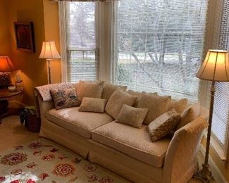 Sofa, drapes, throw pillows, lamps, area rug