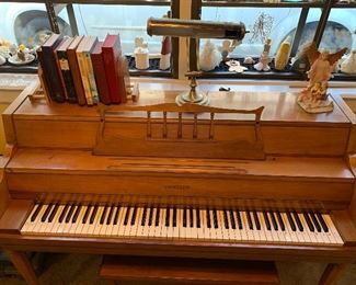 Janssen piano, piano lamp, hymnals