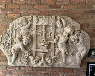 Large plaster wall plaque of angels making wine