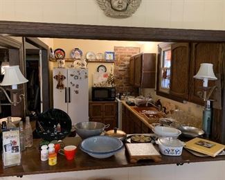 view of second kitchen -everything imagineable. Placemats, napkins, napkin rings, paper products, Corning ware, glasses, plates, silver ware; silver plate, serving plates