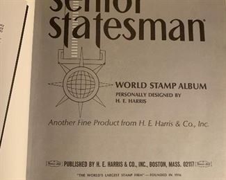 Stamp album with some stamps pasted in