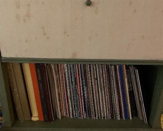 Several old records, LPs, big band, classical easy listening in a vintage record stand