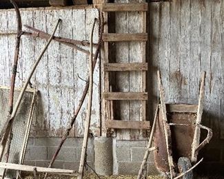 Old metal wheelbarrow, 2 wooden sulky/buggy shafts