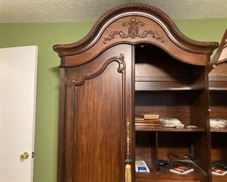 Ample storage in this handsome armoire with drawers at the bottom