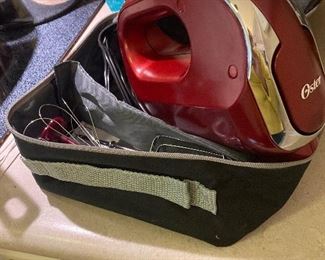 Oster hand mixer with carrier case and bread hooks, whisk, and beaters