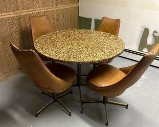 Abalone shell resin fusion cast round top table on metal base.  Includes for mid century modern chairs.