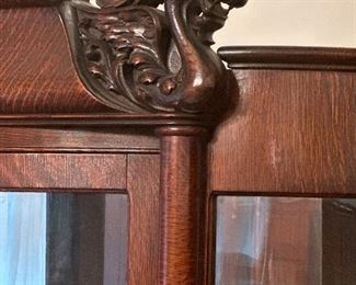 Antique tiger oak bowed China cabinet early 1900s with Chinese dragon embellishment and claw feet