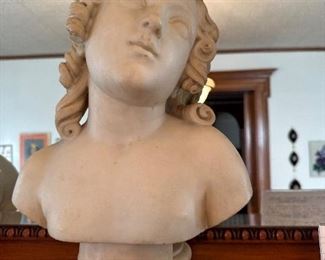 White marble bust of a young woman unsigned