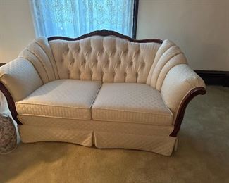 Cream color Kingsley  fabric, and fruitwood loveseat