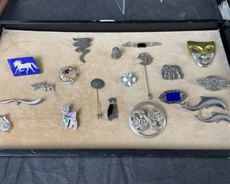 A sample of many sterling brooches/pins available
