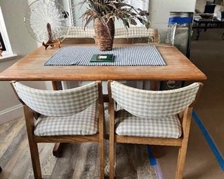 Table with four foldable chairs