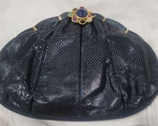 Purse 2 Judith Leiber snake skin purse jeweled clasp with gold accents.  Gently used.   Clean inside and out all stitching looks great.  Comes with comb 13 X 9 