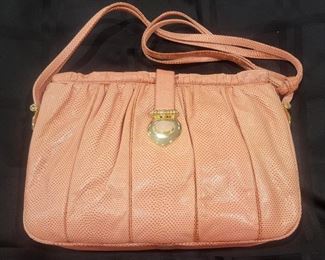 Purse 3 Judith Leiber snakeskin purse.   Color looks to be a salmon.  Gently used clean inside and out.   All stitching looks great.  Comes with comb and mirror.  
11.5 X 8.5