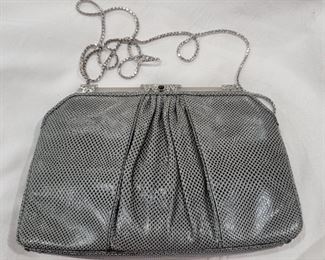 Purse 4 Judith Leiber snakeskin purse.   Gently used.   Grey color clean inside and out.  Comes with comb 9 X 6