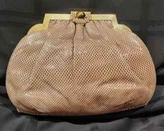 Purse 8 Judith Leiber snakeskin handbag.   Very nice and in gently used condition.   Clean inside and out.  Comes with comb.  10 X 7 