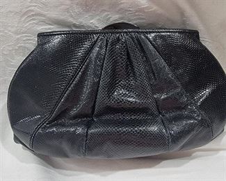 Purse 9 Judith Leiber black snakeskin handbag clutch.   Very nice in Gently used condition.   Inside is very clean.   Outside is nice too.  Very Minimal wear to the bottom.  9.5 X 5.5