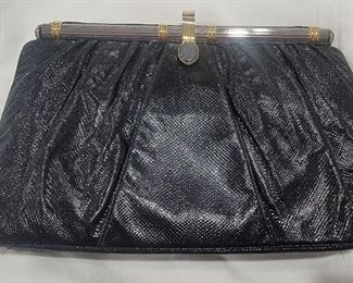 Purse 19 Judith Leiber snakeskin black purse.  Gently used clean inside and out
11 X 7  