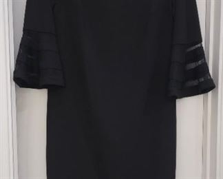 Clothing 8 Calvin Klein basic black dress with nice flowing sleeves.    Unique look.  Size 12 good gently worn dress.  