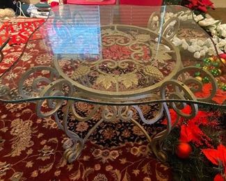 side table with heavy metal base and glass top