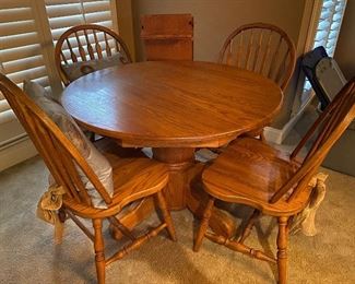 oak pedestal table with 4 chairs