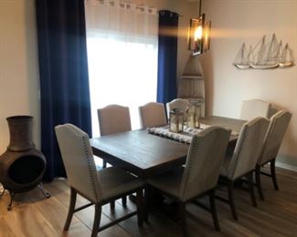 Johnelle dining table with 6 chairs, Ashley, 1 yr old, like new.