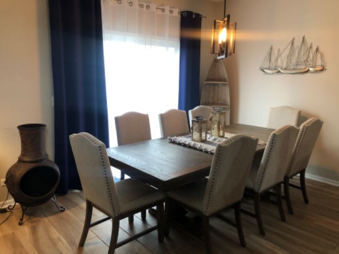 Johnelle dining table with 6 chairs, Ashley, 1 yr old, like new.