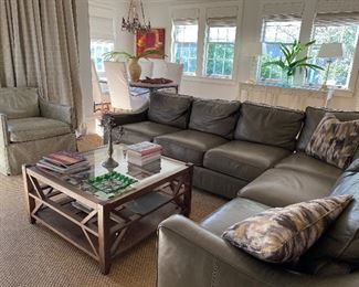 Great looking leather sectional sofa - in three pieces, wooden tiered beveled glass top coffee table, beige leather club chair, white linen wing back chair, large Sony flatscreen TV