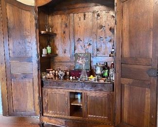 Open Armoire with custom bar interior 