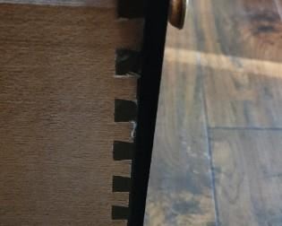 dovetail detail on drawers in Mahagony bifold door cabinet