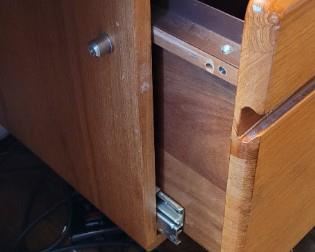 locked file drawer on teak desk