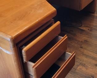 teak desk with three drawers on left and one locked file drawer on right, 6' long