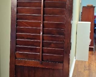 Pier 1 Imports shuttered door used as a room divider