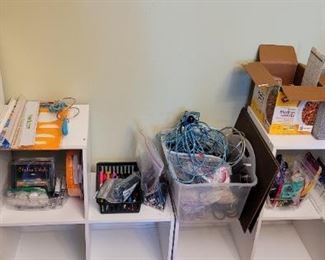 several white storage units and tons of office supplies