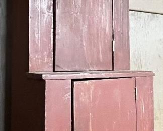 SMALL STEPBACK CUPBOARD IN RED PAINT 