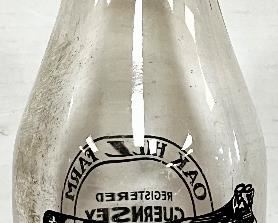REVERSE OF N.J. MILK BOTTLE “QUALITY GUERNSEY PRODUCTS” 