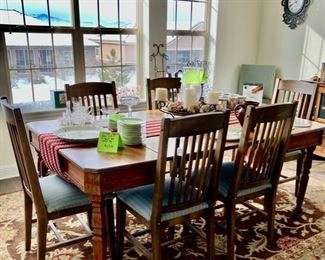 Rustic Carved Dining Table with 3 Leaves; 6 upholstered dining chairs.