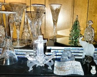Waterford toasting flutes, paper weights, elephants. Swarovski animals and camera