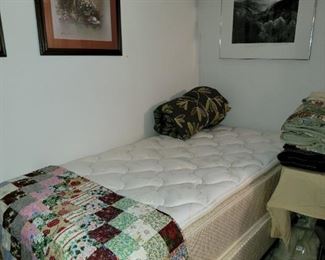 Twin bed. Handstitched quilt