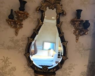 Ornate mirror and sconces with gold gilted wood