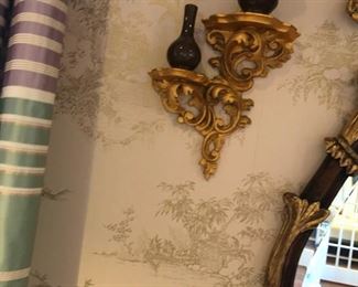 Closeup of the sconce shelves next to the mirror