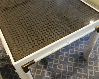 Side table with brass in a bamboo design with rattan under the glass. $95