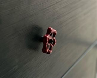 Organized Living Dresser with Red Faucet Pulls