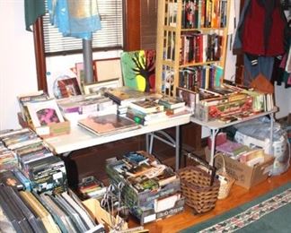 Large amount of books, frames, some records, and office supplies. 