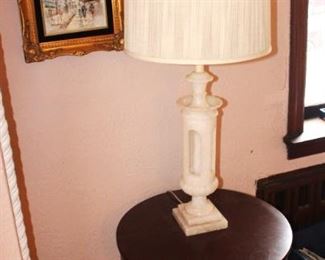 Alabaster lamp and small round table.